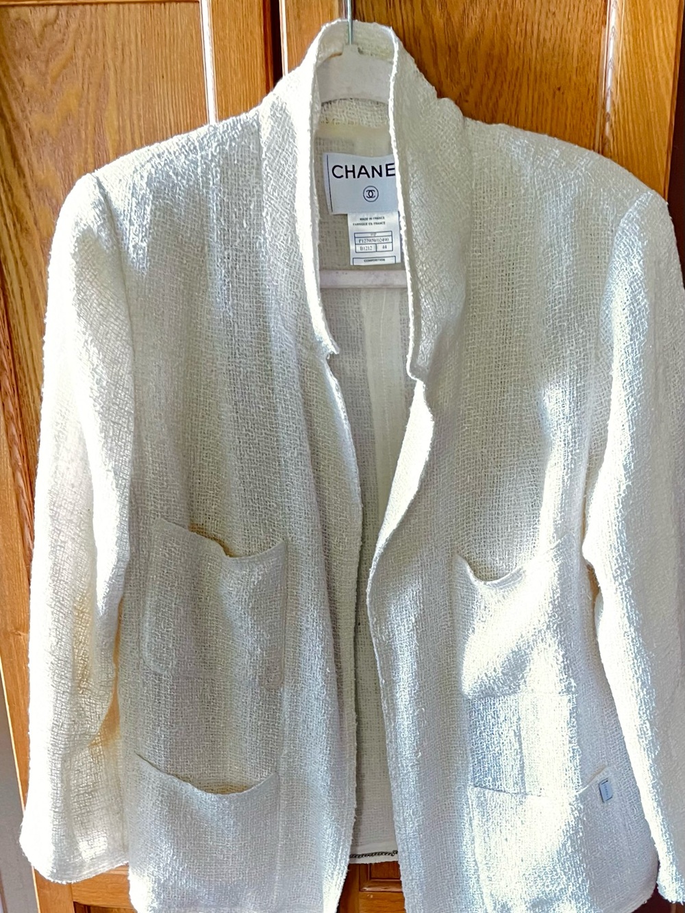CHANEL Cream Bouclé Open-Front Jacket with Patch Pockets and Chained Hem